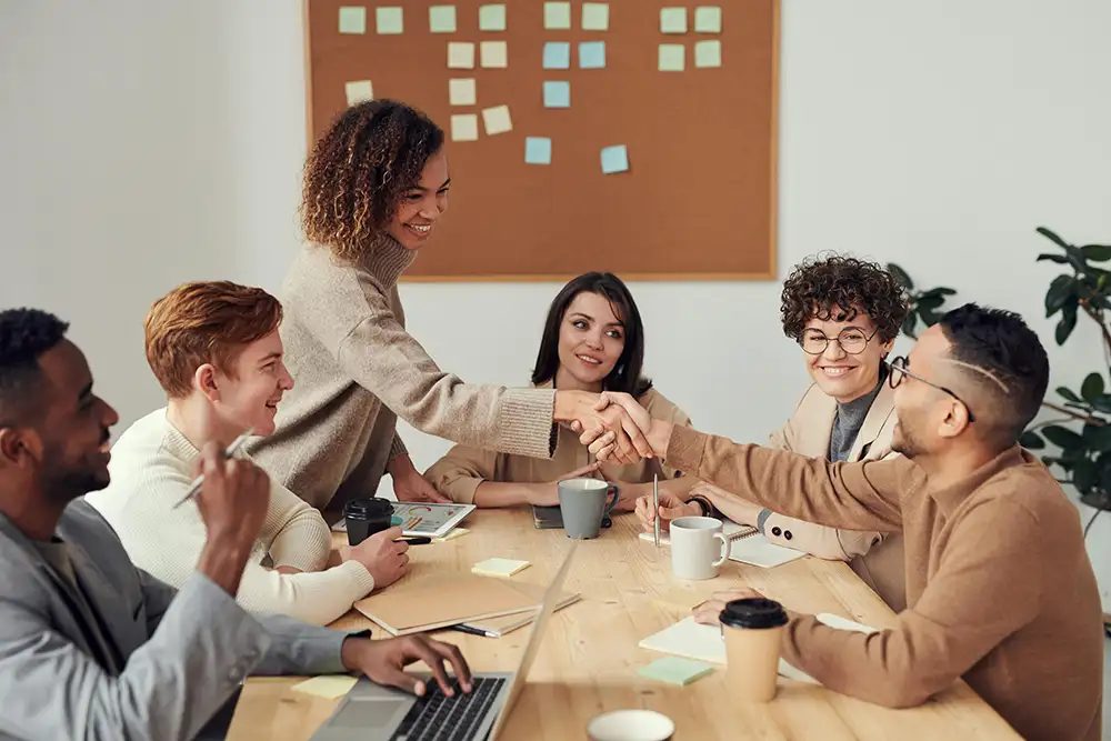 A connect group laughing around a table